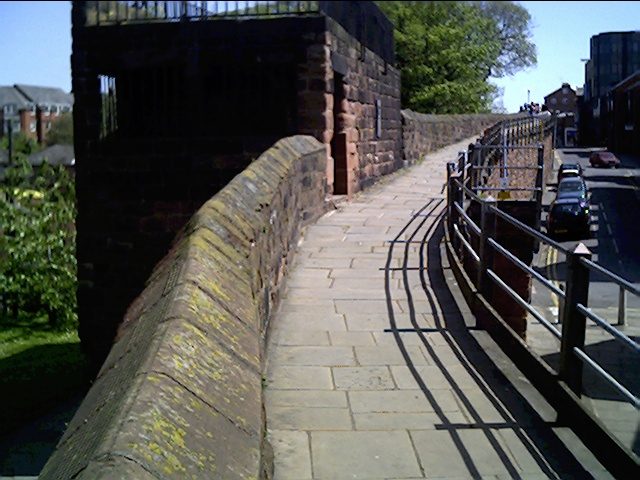 The stone city walls of Chester, with the walkway along the top.