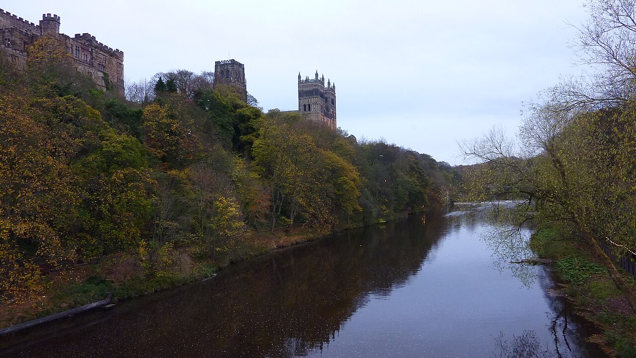 Durham Cathedral and castle above the wooded banks of the River Wear.