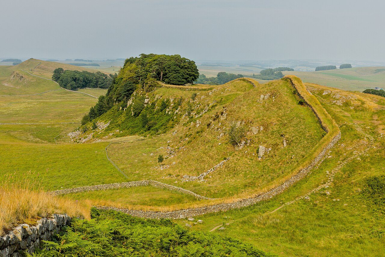 Hadrian’s Wall following the crest of Housesteads Crags under a wide sky.
