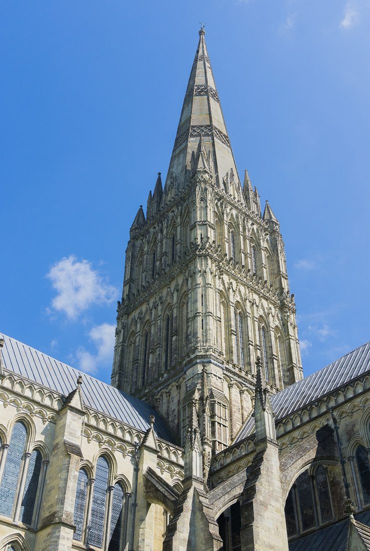 The spire of Salisbury Cathedral rising above the close.